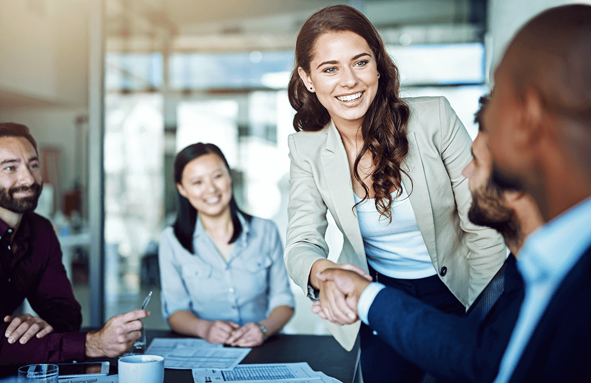Integral Rx team members meeting with a customer